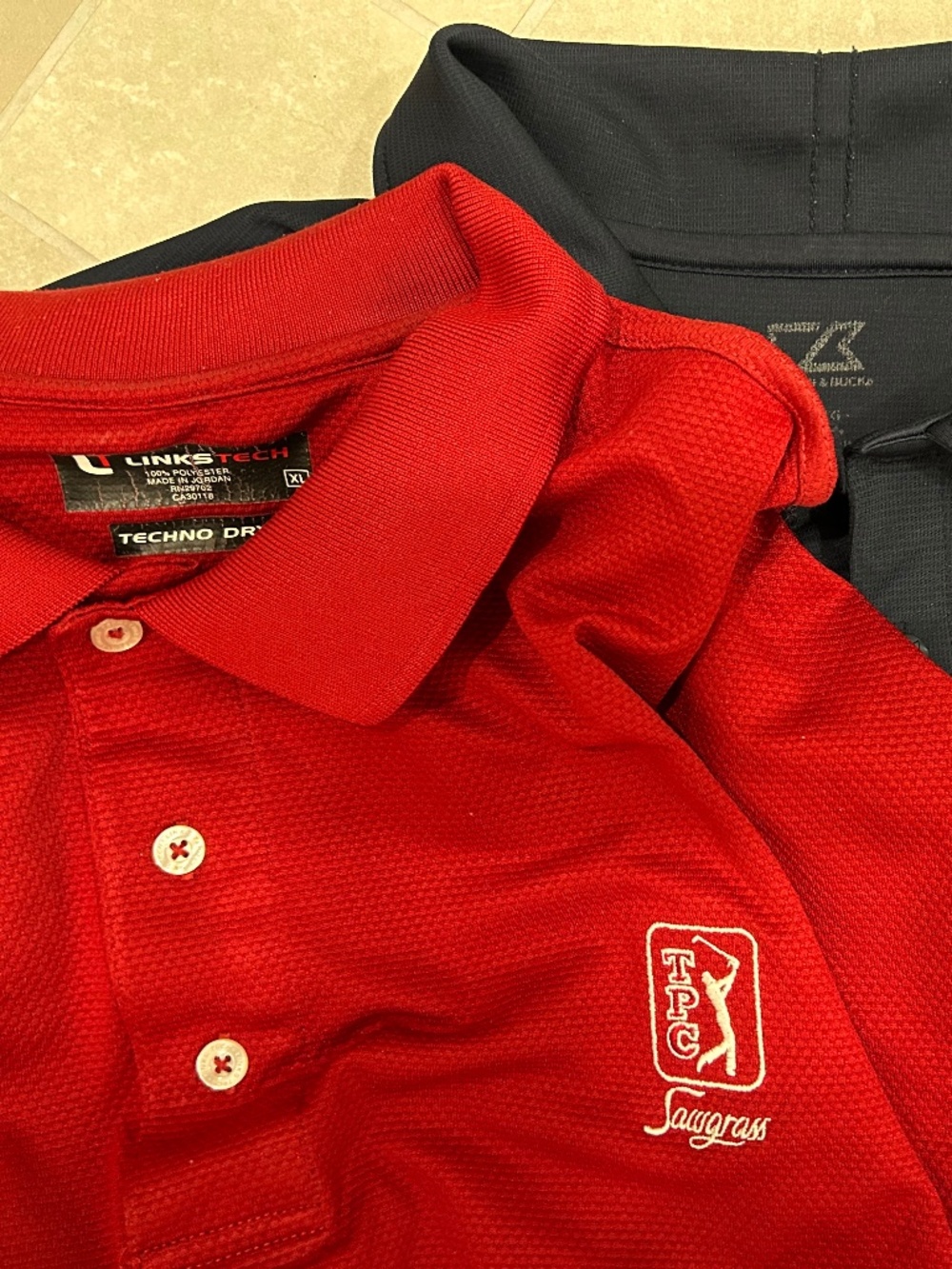 Two (2) Men’s XL Performance golf shirts EUC TPC Sawgrass & Poland Spring logos